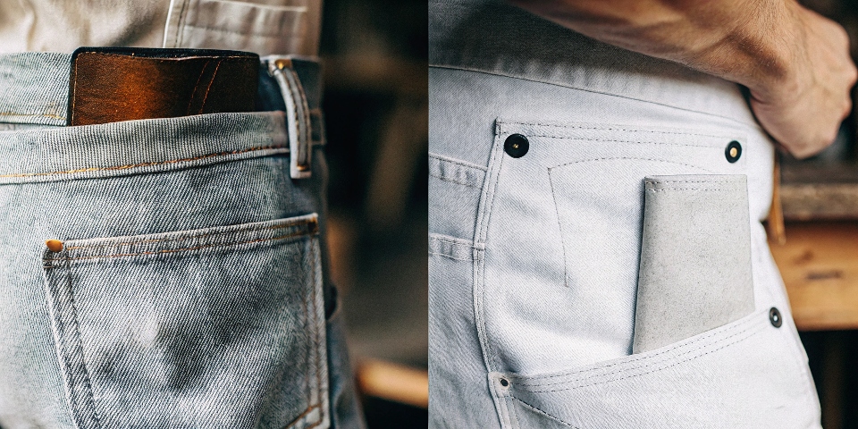 A side-by-side photo showing a classic riveted pocket corner next to a modern denim pocket reinforced with only a bar tack stitch.