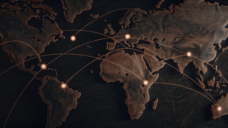 A world map with dotted lines connecting a central design hub to various factory locations across the globe.