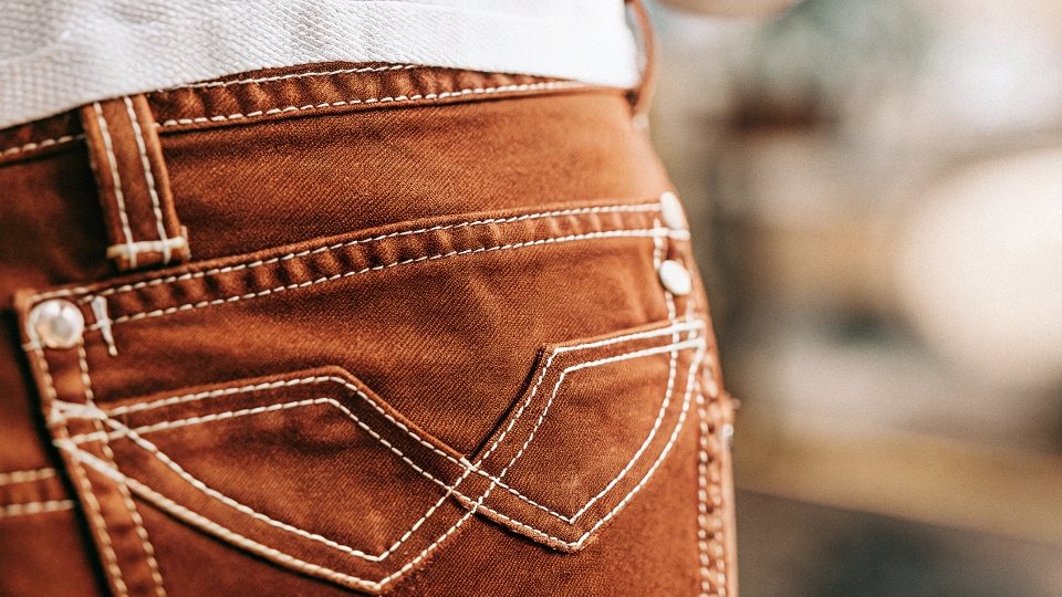 A close-up view of the thick Super T stitch on a True Religion jean pocket.