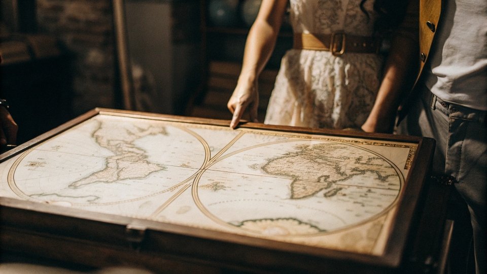 An old world map pointing to Nîmes, France, and Genoa, Italy, showing the two points of origin.