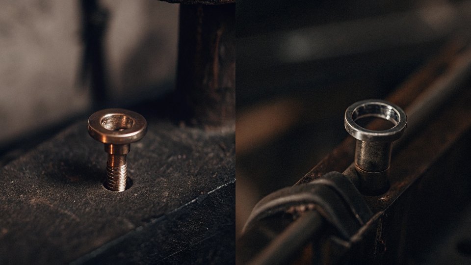 A split-screen image clearly showing a solid copper rivet on the left and a hollow silver grommet/eyelet on the right.