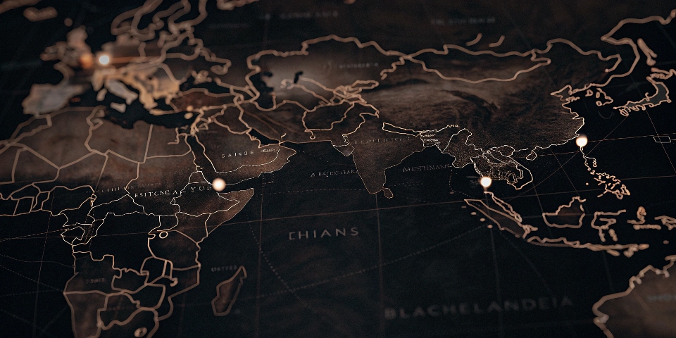 A world map with pins in countries known for denim manufacturing like China, Vietnam, Bangladesh, and Mexico.