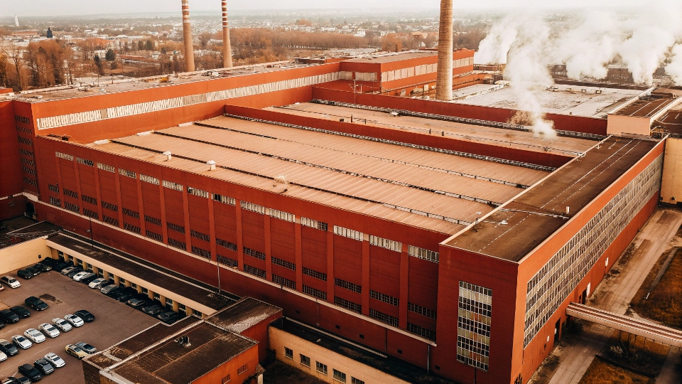 An aerial view of a massive, modern textile factory, representing the type of facility that handles large-scale production.