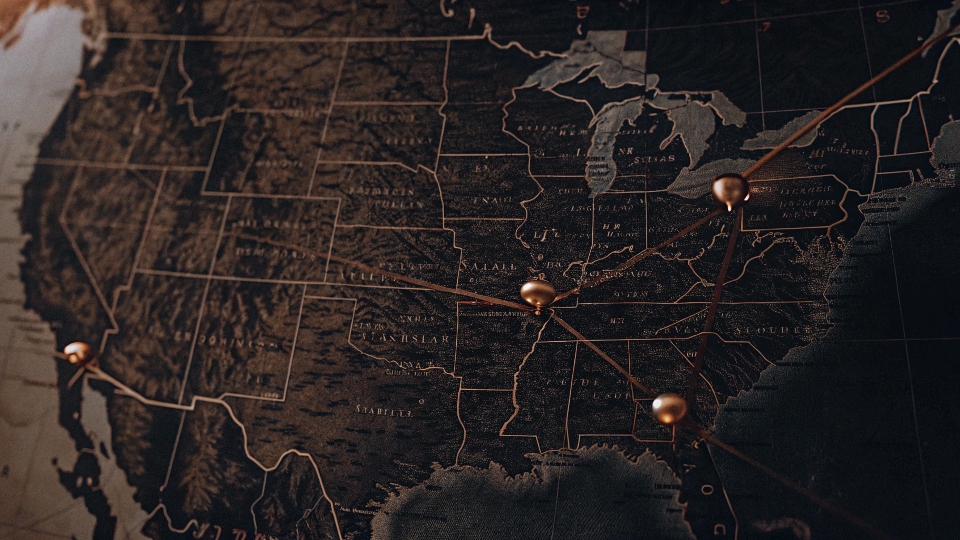 A map of North America with pins on a hypothetical factory location in Texas, USA, and another in a manufacturing hub in Mexico.