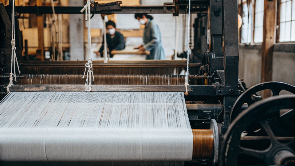 Kojima, the Holy Land of Japanese Denim An old shuttle loom machine weaving selvedge denim in a Japanese mill