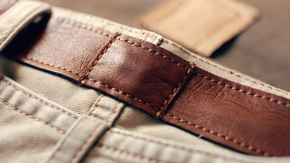 A close-up shot of a clothing label on a pair of Lee jeans clearly stating "Made in Bangladesh".