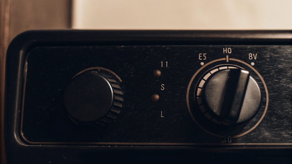 A close-up of a washing machine's control dial set to the hottest temperature setting.
