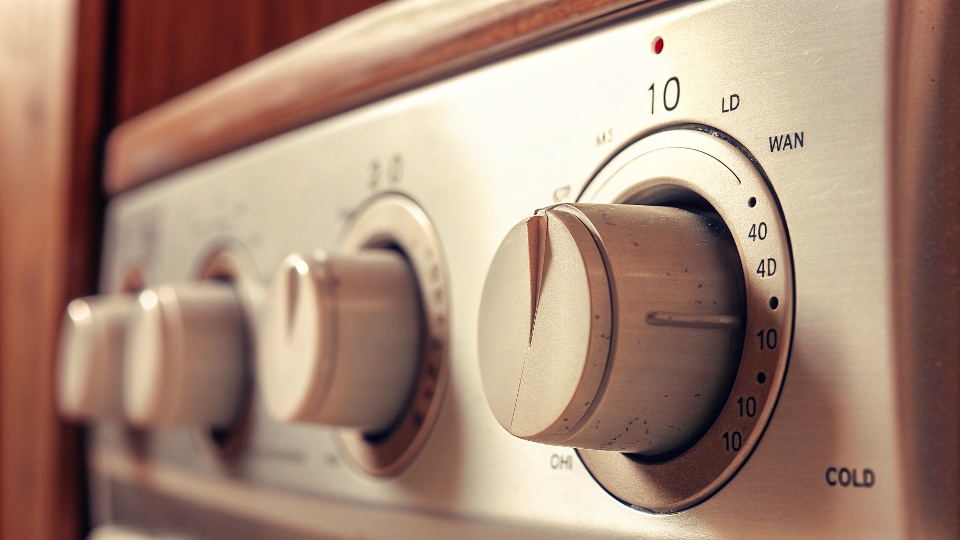 A washing machine dial set to a cold, gentle wash cycle.