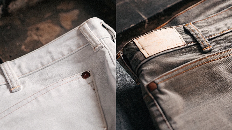 A side-by-side photo: on the left, a standard Levi's 501 with an overseas tag; on the right, a premium LVC jean with a distinct "Made in the USA" label.