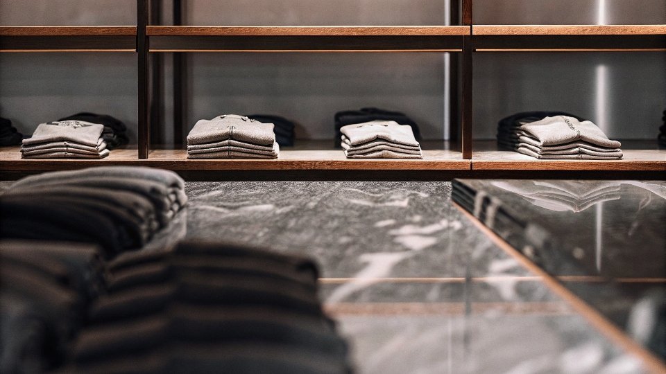 A display of neatly folded Earl Jeans in a high-end boutique setting from the early 2000s.