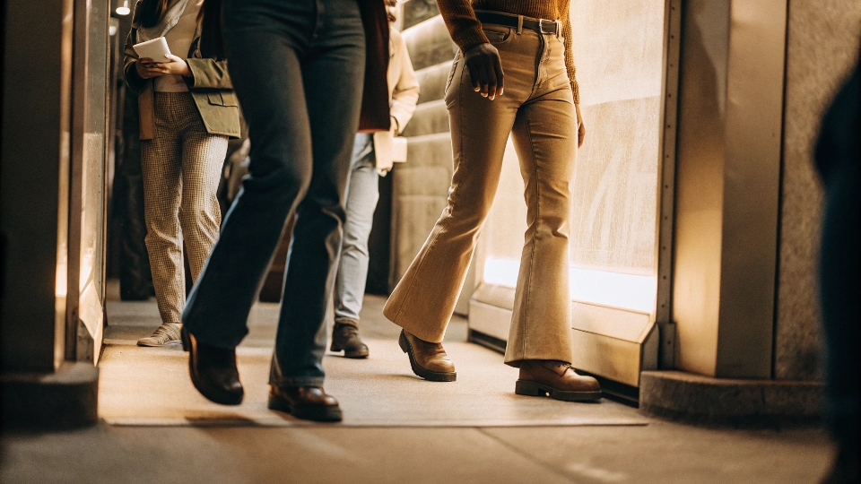 A futuristic-looking image of people wearing stylish, modern jeans in 2025