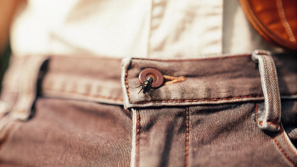 Jeans Feeling Too Tight in the Waist A close-up shot of a jean's button and fly that is clearly straining to close