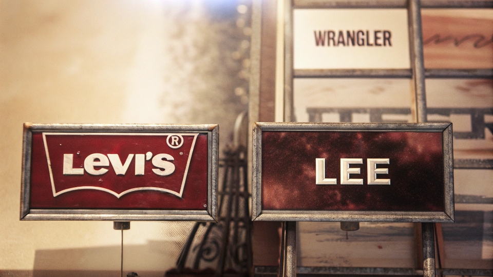 A vintage-style collage featuring the classic logos of Levi's, Lee, and Wrangler