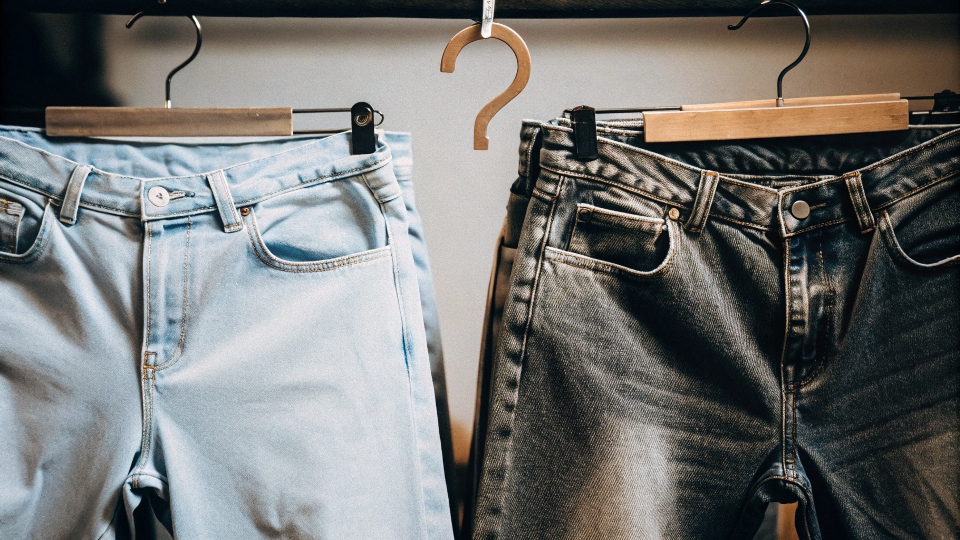 A pair of Uniqlo jeans with a question mark over the price tag