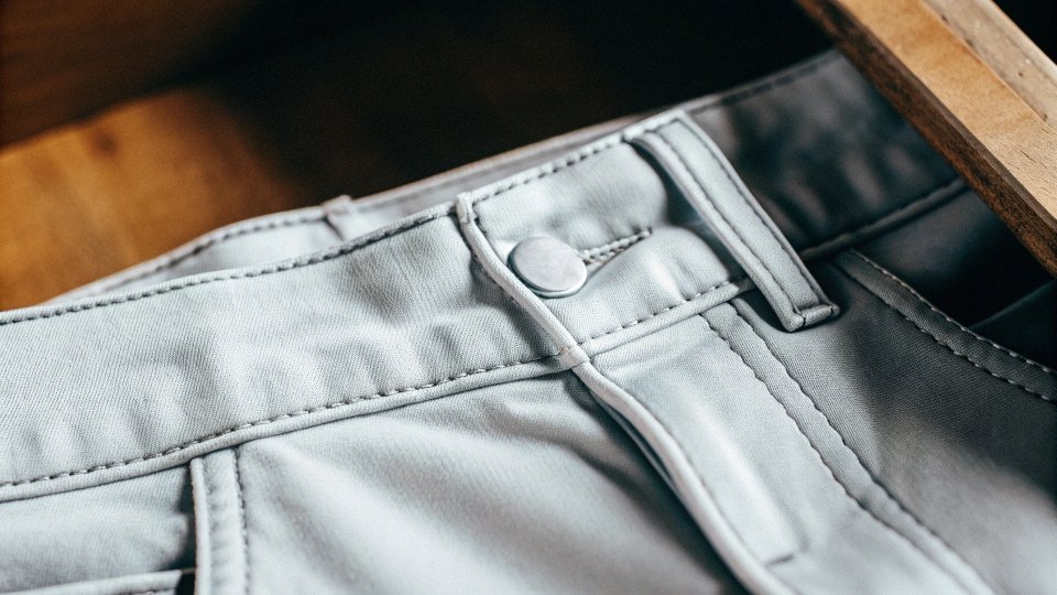 A close-up shot of the high-quality fabric and stitching detail on a pair of Calvin Klein jeans