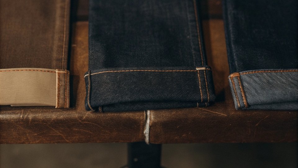 Different Weights of Denim Fabric Three different swatches of denim fabric, from lightweight to heavyweight