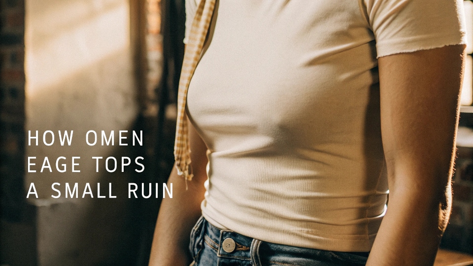 A person wearing a slim-fitting American Eagle t-shirt