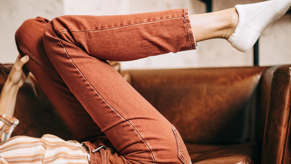 A person easily moving and stretching in a pair of modern stretch jeans