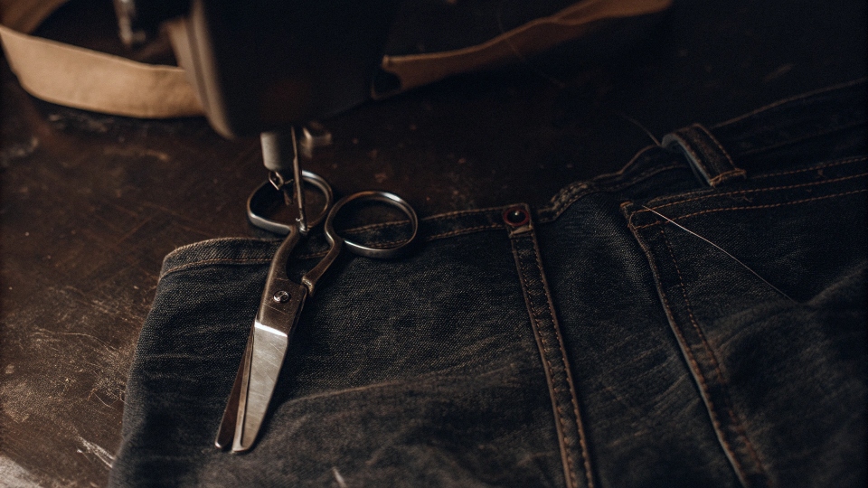 An overhead shot showing a jean leg cut, ready to be sewn