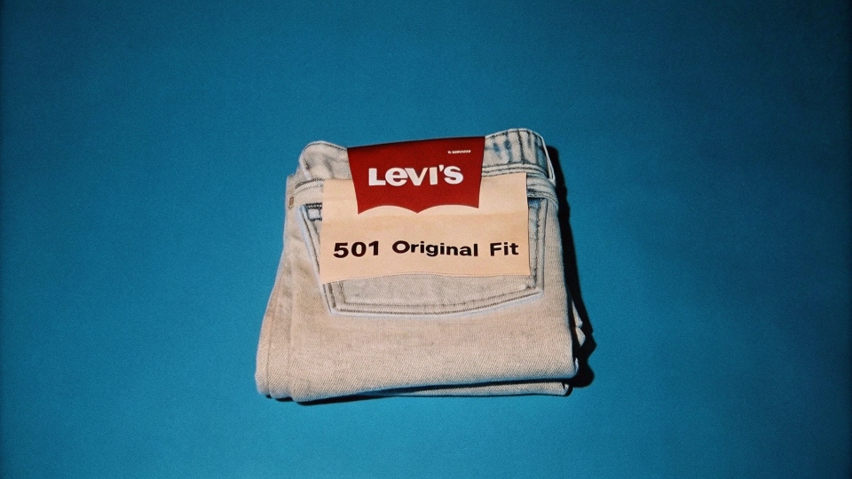 Levi's 501 Jeans Worn by Steve Jobs A close-up of a pair of classic light-wash Levi's 501 jeans, folded neatly