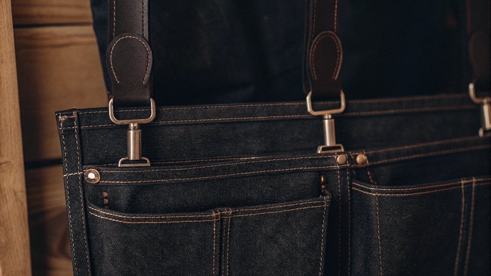 A stylish bag made from the top part of a pair of jeans, showcasing the pockets and waistband