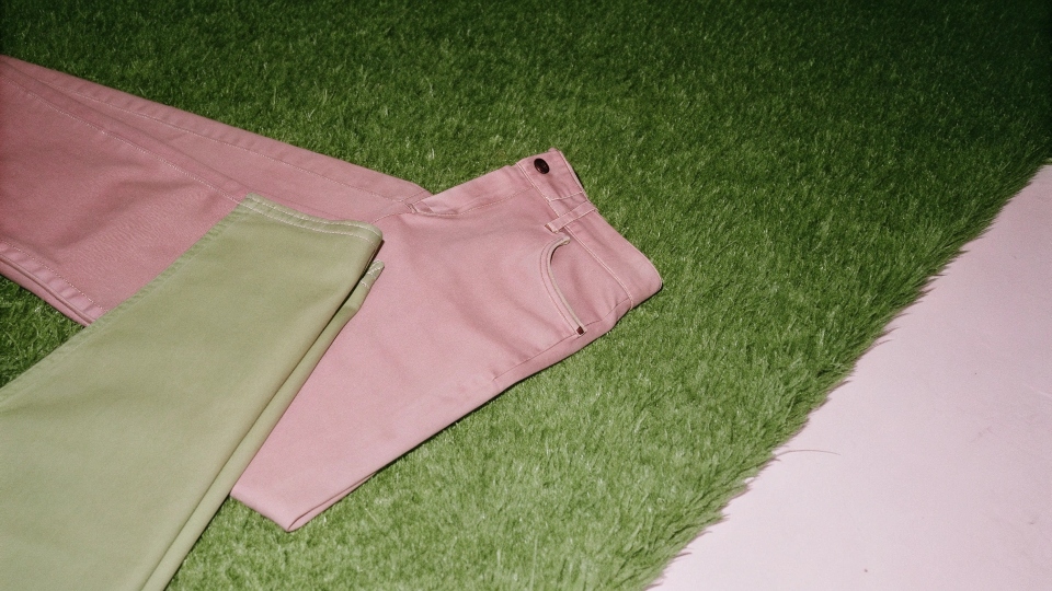 Super Soft Fabric of Men's Jeans A close-up shot showing the soft, pliable texture of a pair of lightweight jeans being folded