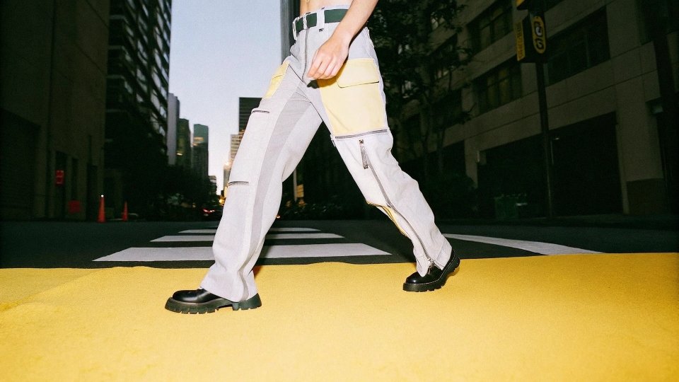 Modern Men's Cargo Jeans A stylish man wearing modern, well-fitting cargo jeans in an urban setting