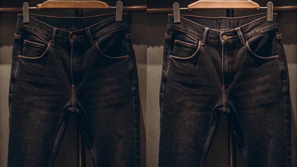A pair of jeans with a noticeable gap at the back of the waistband