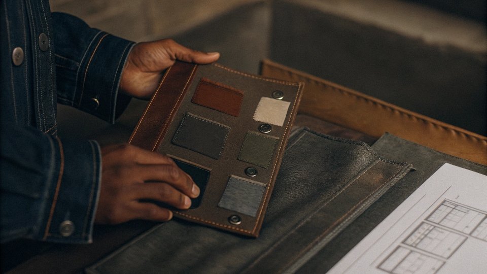 Monitoring Effluent Discharge Levels A technician collecting a water sample from an effluent outlet, with an online monitoring sensor visible in the background