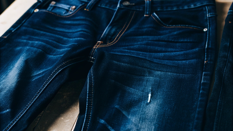 Close-up of the soft texture on a pair of enzyme-washed jeans