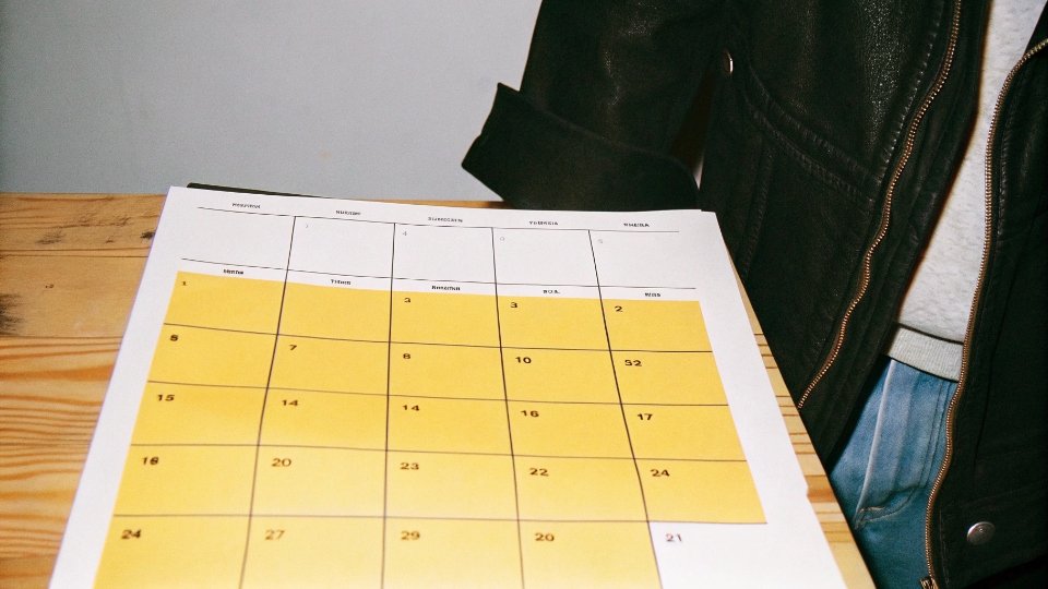 A calendar with key production milestones for a custom jeans order clearly marked