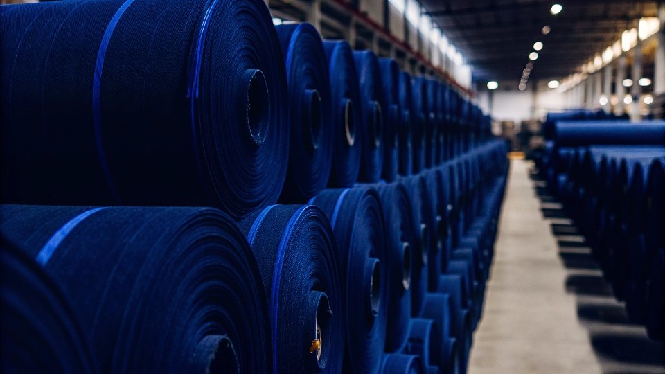 The Big 3 American Denim Brands A collage of vintage logos for Levi's, Lee, and Wrangler.