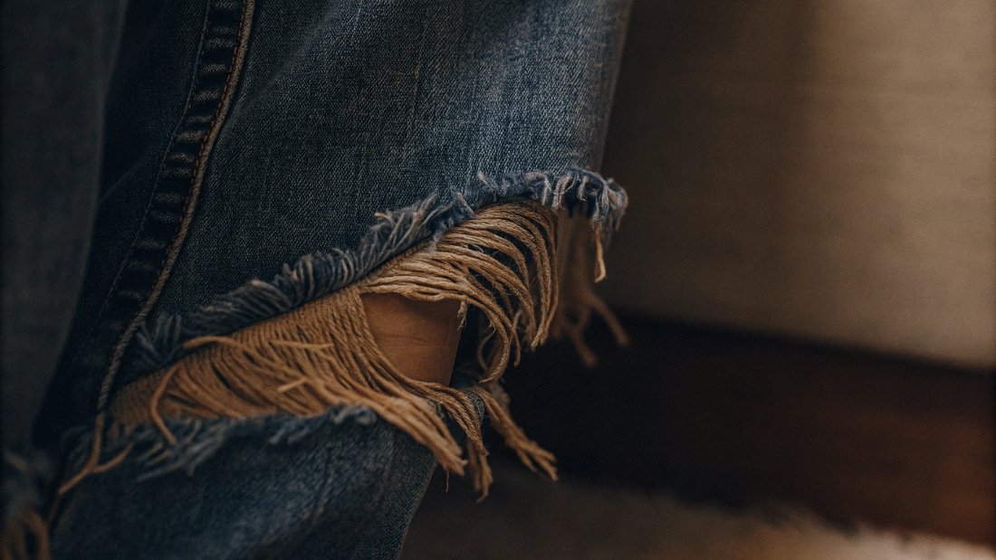 How to Fray a Jean Hem A close-up shot of a perfectly frayed denim hem.