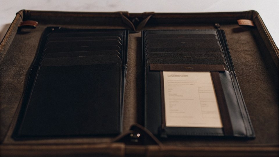 Export Documents for Rebate Application A neatly organized folder containing a customs declaration, VAT invoice, bill of lading, and a sales contract.