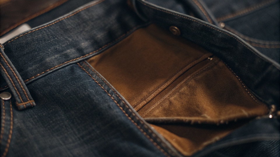 High-Quality Jeans Pocket Lining A close-up shot of the inside of a jeans pocket, showing the high-quality lining material neatly installed