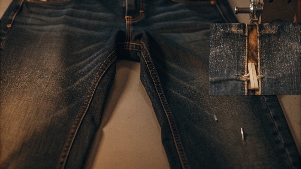 Addressing Customer Complaints Linked to Jean Production A detailed photo showing a manufacturing flaw on a pair of jeans, as sent by a retail customer.