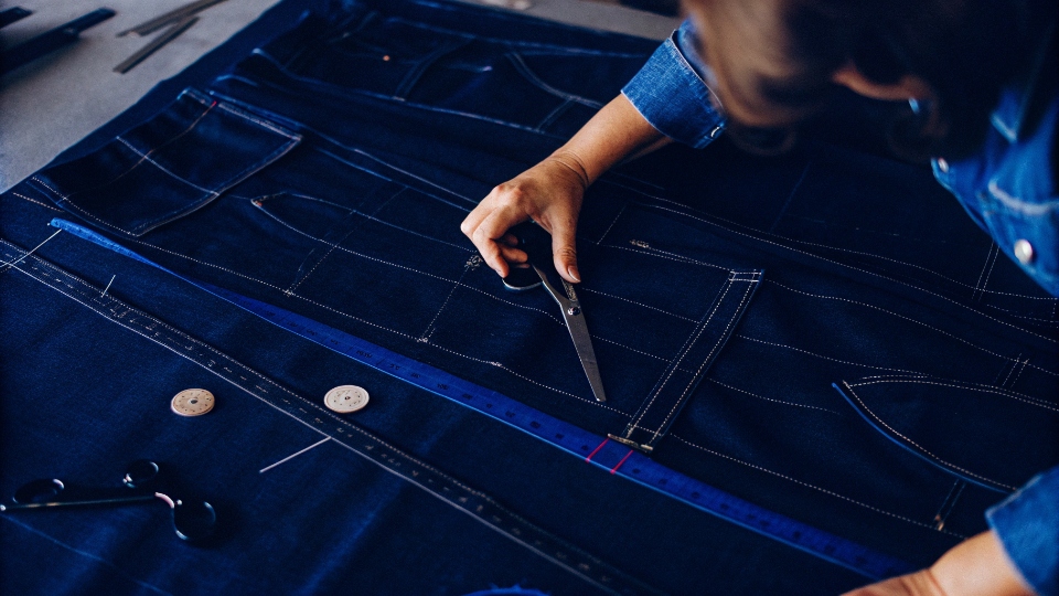 Grading Jeans Patterns for Different Size Ranges A pattern maker working on both a small children's jeans pattern and a large plus-size pattern.