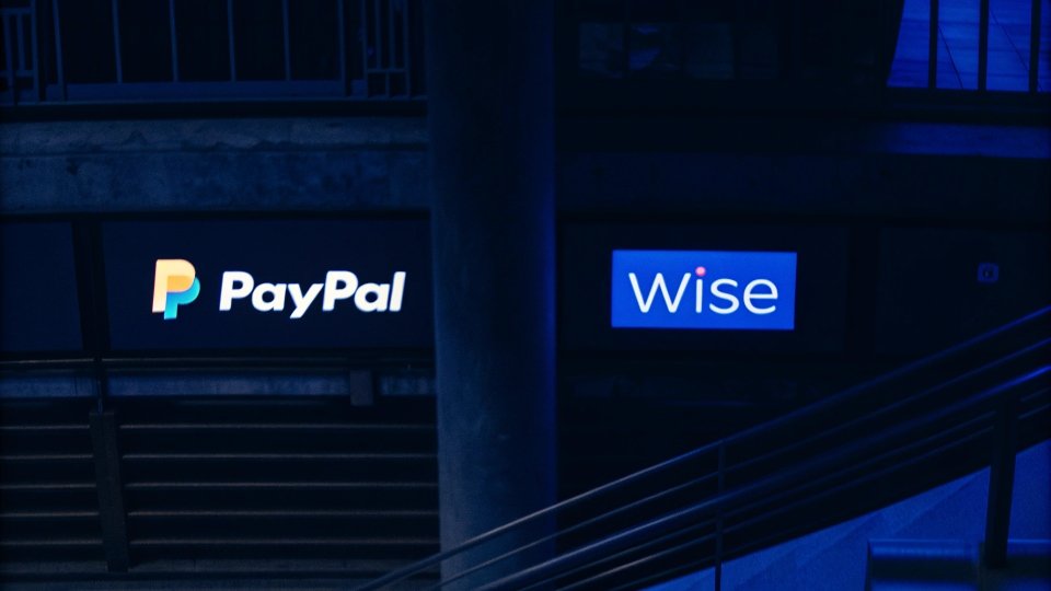 Comparing Payment Platforms for China Factories Logos of PayPal, Wise, and a generic bank transfer icon are displayed side-by-side.