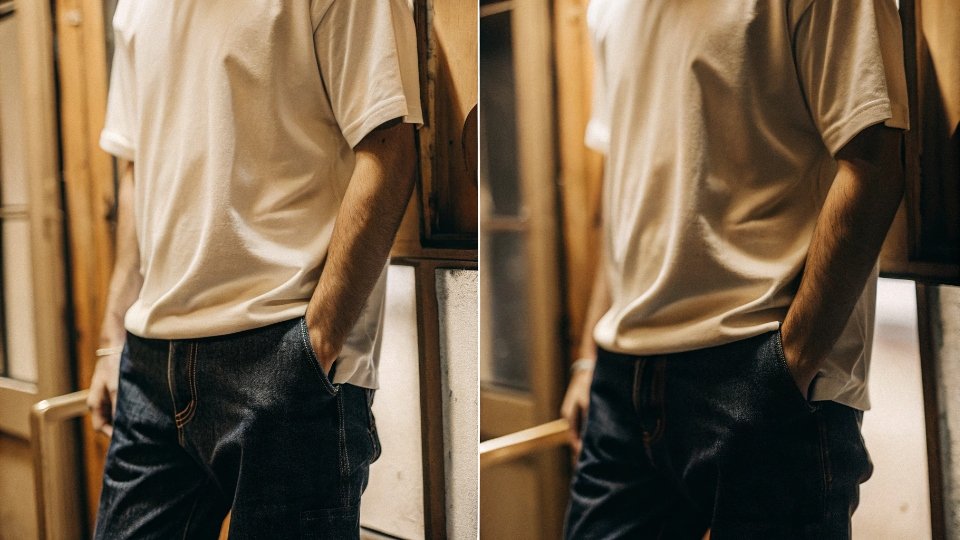 Man in Oversized T-shirt and Baggy Jeans A man wearing dark baggy jeans with a crisp, slightly oversized white t-shirt, showing a clean and modern silhouette.