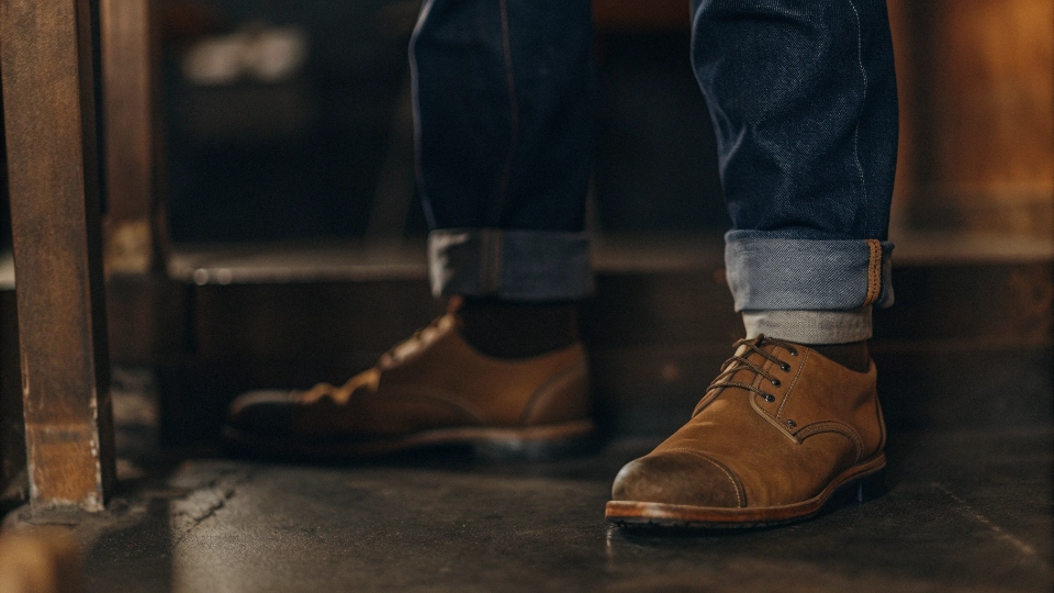 Cuffing and Rolling Baggy Jeans A close-up shot showing the difference between a single large cuff and multiple small rolls on baggy jeans.