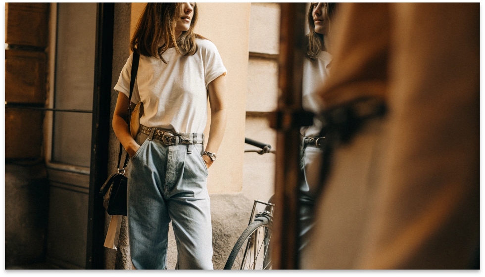 Styling a Top with Baggy Jeans A person looking effortlessly stylish in high-waisted baggy jeans and a simple tucked-in t-shirt.