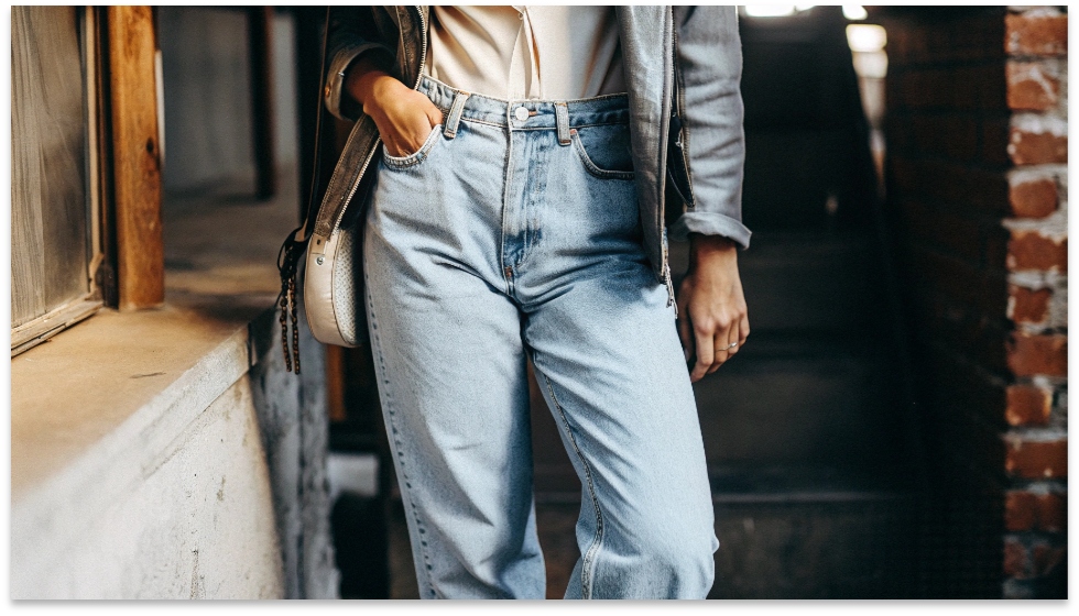 The Classic Boyfriend Jean Look A stylish woman wearing a classic pair of cuffed boyfriend jeans, looking effortlessly chic.