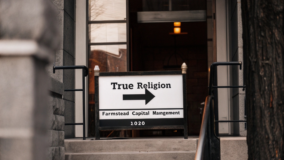 True Religion's Lender Ownership Structure A simple flowchart showing a bank icon leading to the True Religion logo, signifying lender ownership.