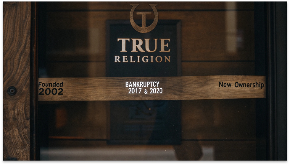The Ownership Journey of True Religion Jeans A graphic showing the True Religion horseshoe logo with text bubbles pointing to key historical moments: "Founded 2002", "Bankruptcy 2017 & 2020", "New Ownership".