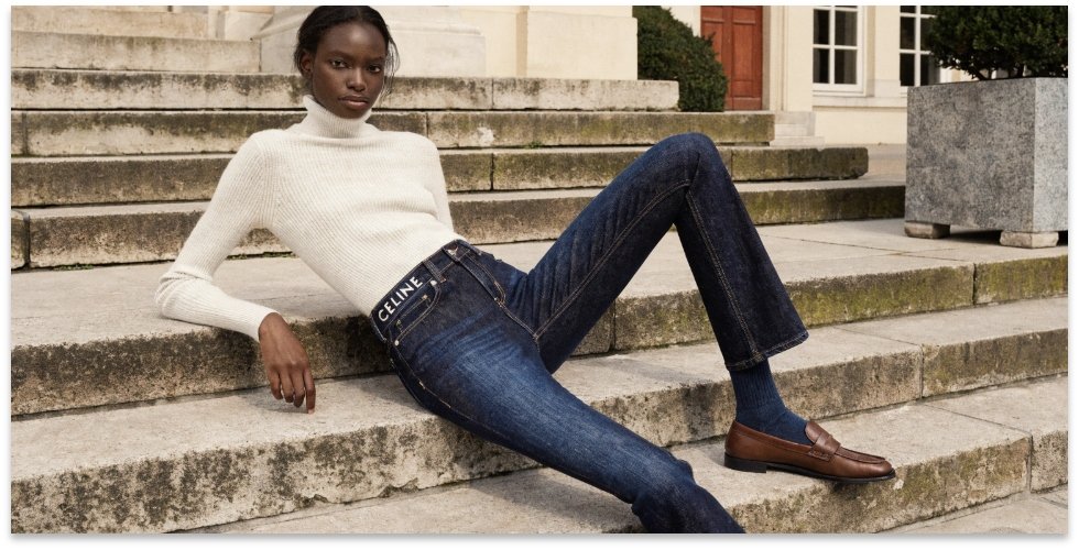 The Understated Luxury of Celine Denim A model showcasing a pair of perfectly tailored Celine jeans with a minimalist aesthetic.