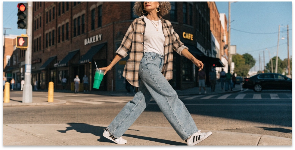 Stylish Woman Over 40 Wearing Jeans A stylish woman in her 50s confidently wearing a pair of modern, well-fitting jeans.